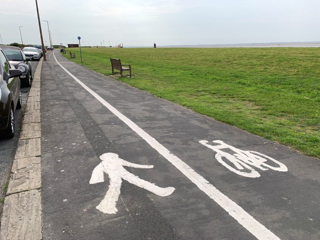Free on street parking, footpath, cycle lane, benches and litter bins