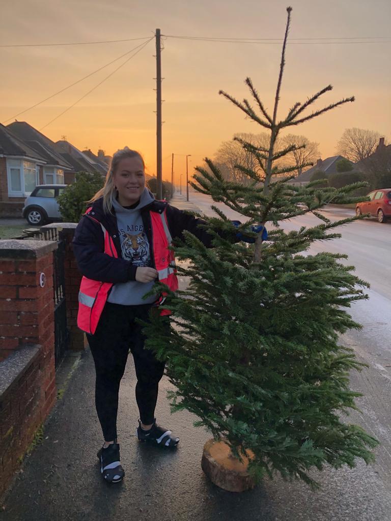 Emma Lonican collecting Christmas trees